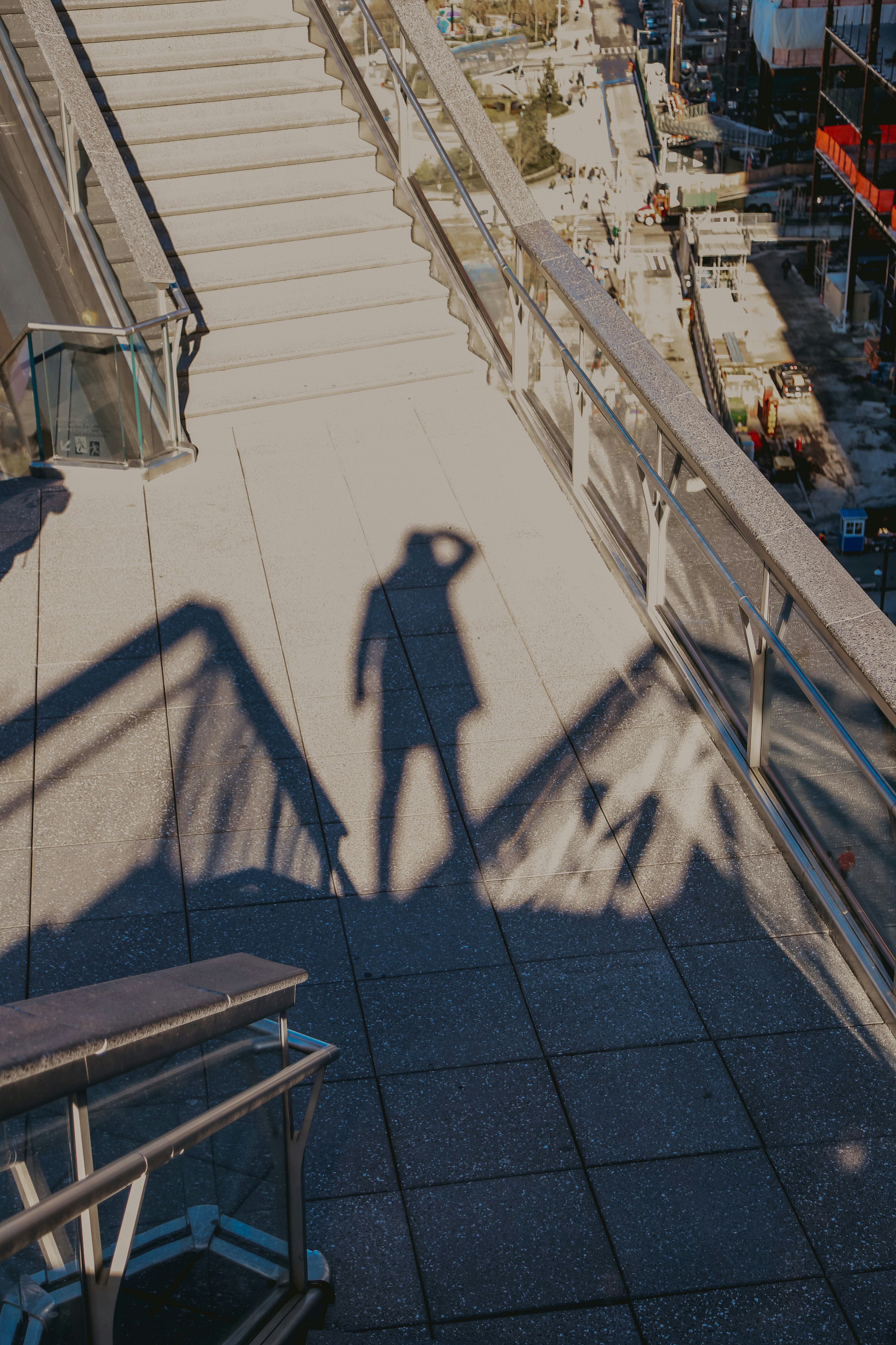 man in black jacket standing on white floor tiles